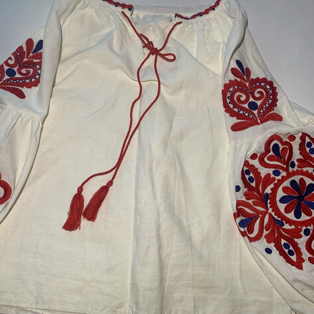 White shirt with red embroidery